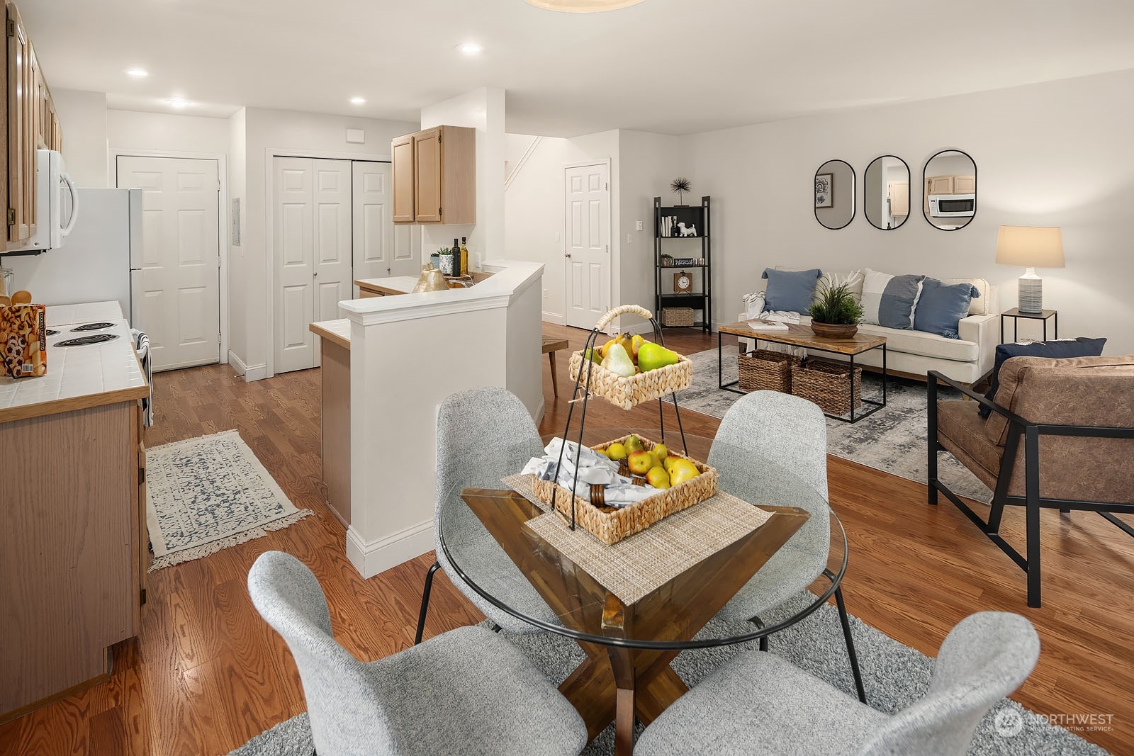 23111 15th Avenue Southeast, Unit E4 Bothell, WA 98021 - Photo 11 of 31 a living room with furniture and kitchen view