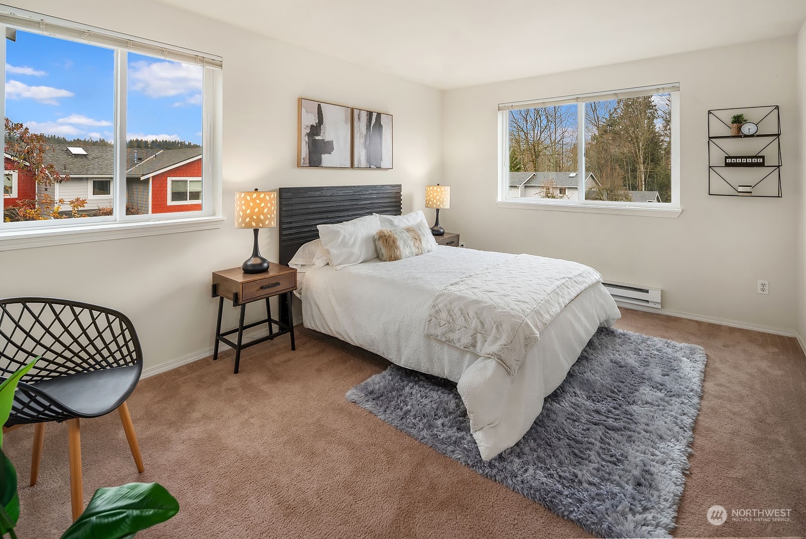 23111 15th Avenue Southeast, Unit E4 Bothell, WA 98021 - Photo 16 of 31 a bed room with a bed and a chair