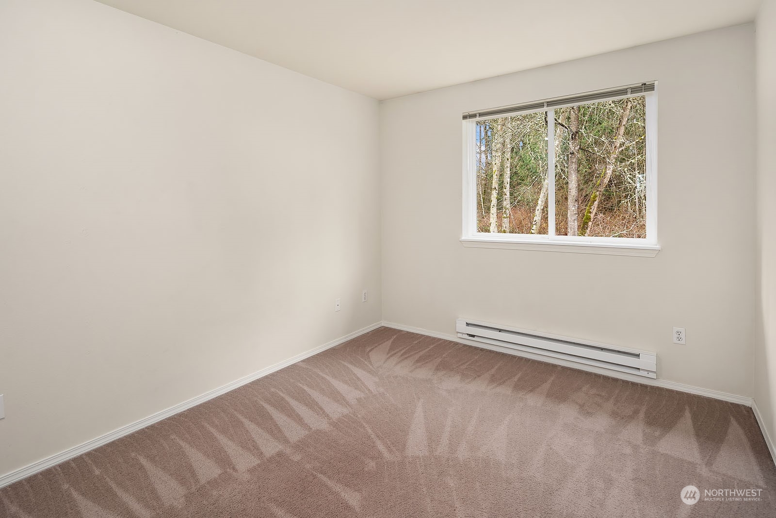 23111 15th Avenue Southeast, Unit E4 Bothell, WA 98021 - Photo 18 of 31 an empty room with a window