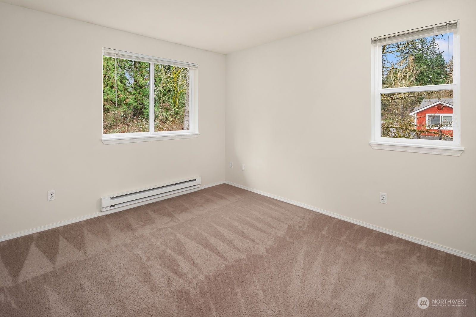 23111 15th Avenue Southeast, Unit E4 Bothell, WA 98021 - Photo 19 of 31 an empty room with windows