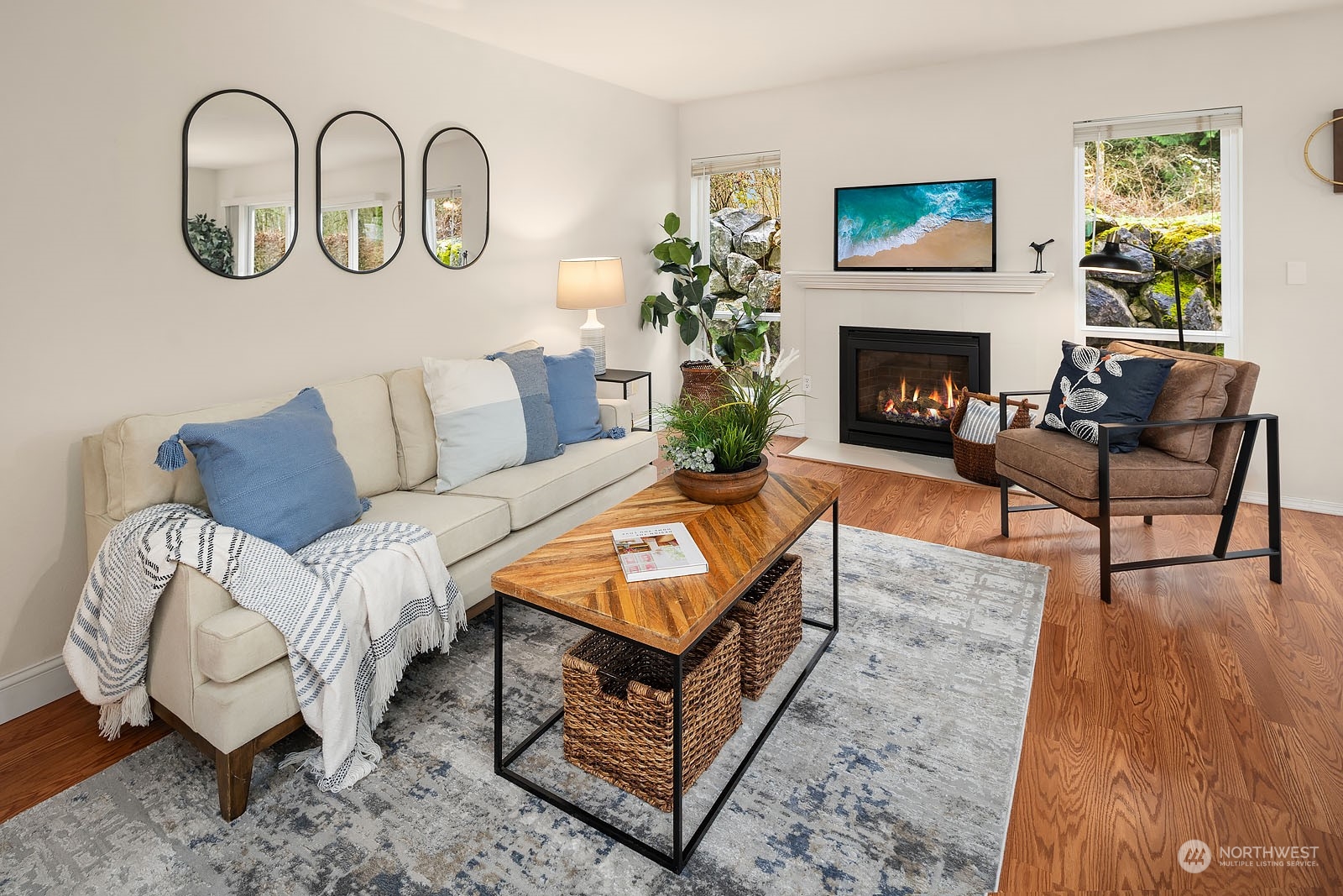 23111 15th Avenue Southeast, Unit E4 Bothell, WA 98021 - Photo 6 of 31 a living room with furniture and a fireplace
