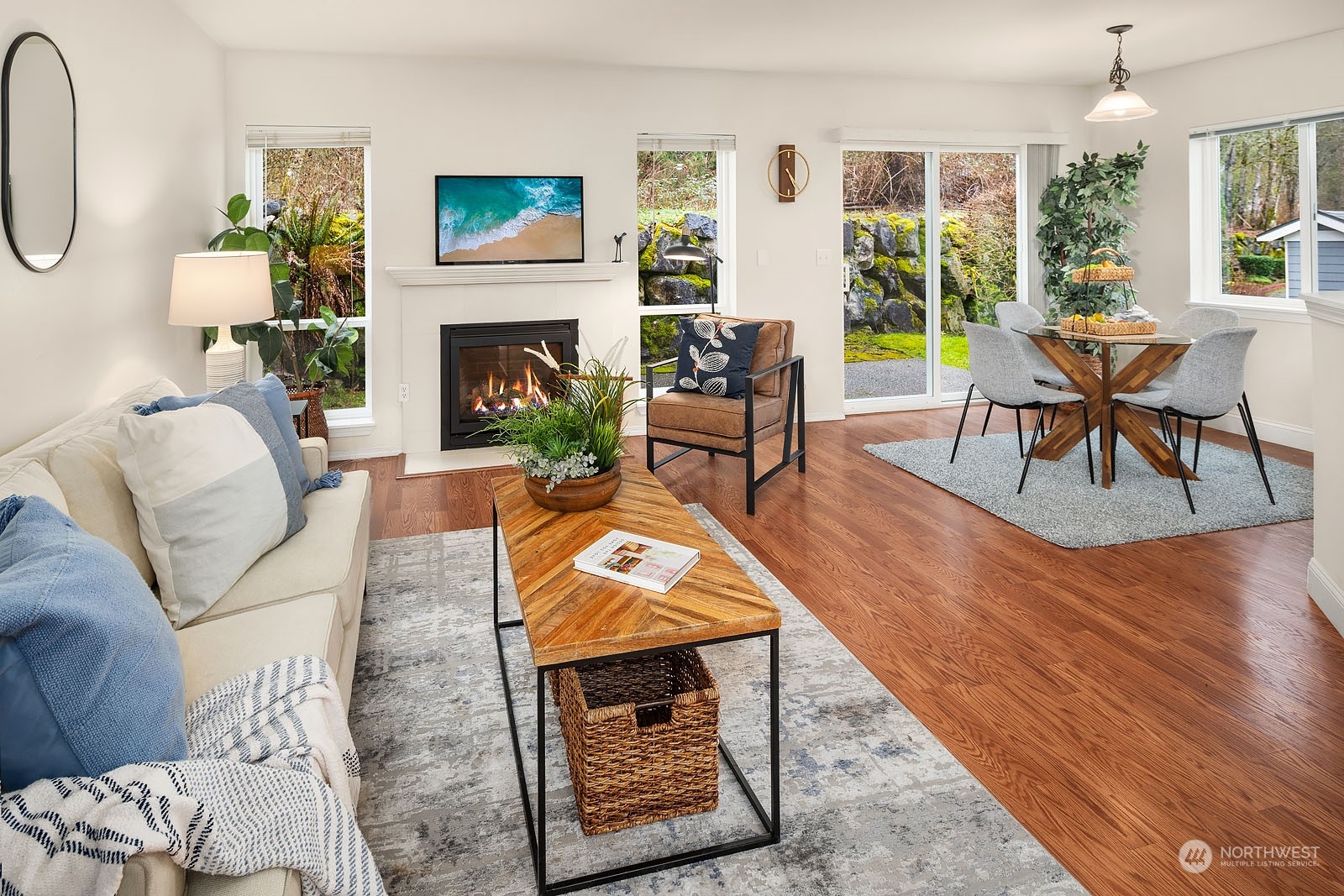 23111 15th Avenue Southeast, Unit E4 Bothell, WA 98021 - Photo 7 of 31 a living room with furniture a rug a fireplace and a large window