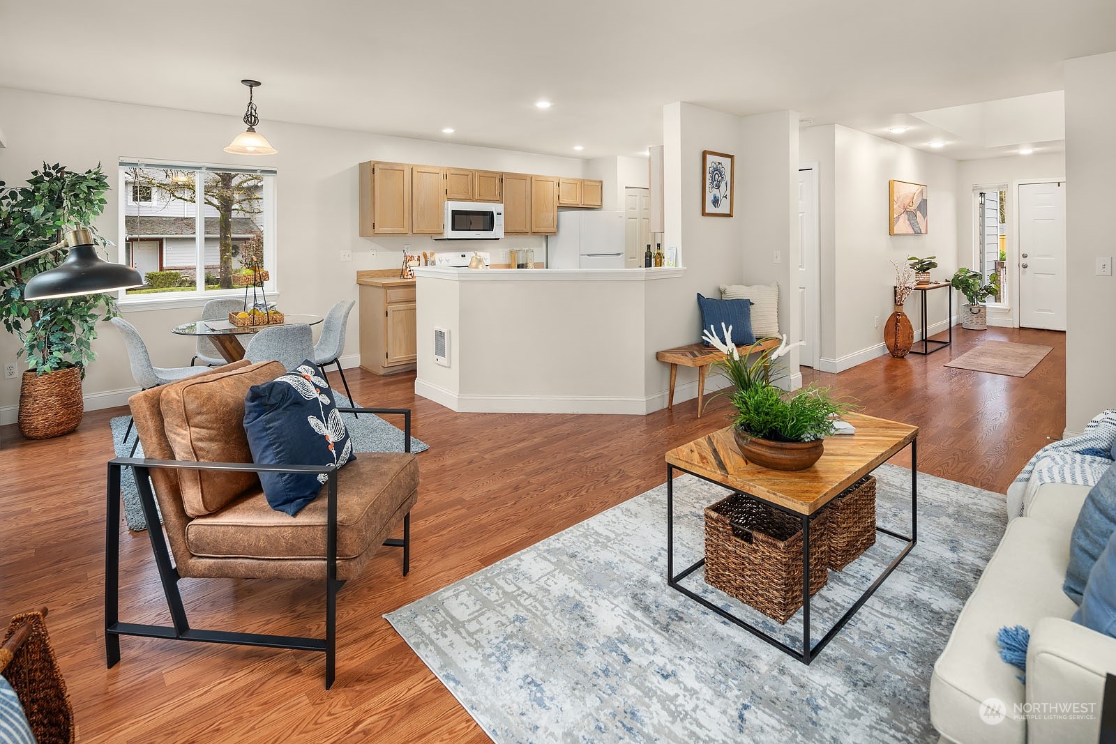 23111 15th Avenue Southeast, Unit E4 Bothell, WA 98021 - Photo 8 of 31 a living room with furniture and a kitchen