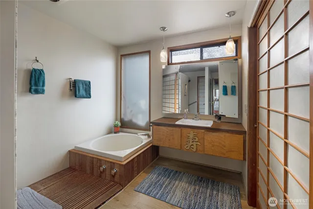 a bathroom with a bathtub and shower