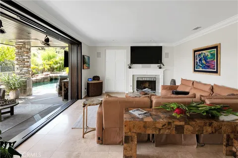 a view of entryway livingroom and hall with wooden floor