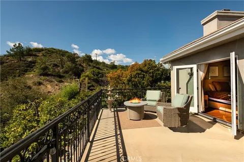 a view of roof deck with furniture