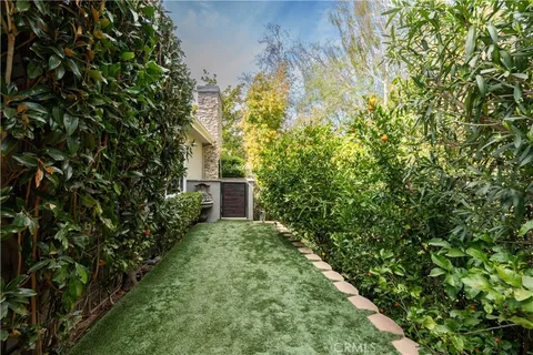 an aerial view of a house with a garden