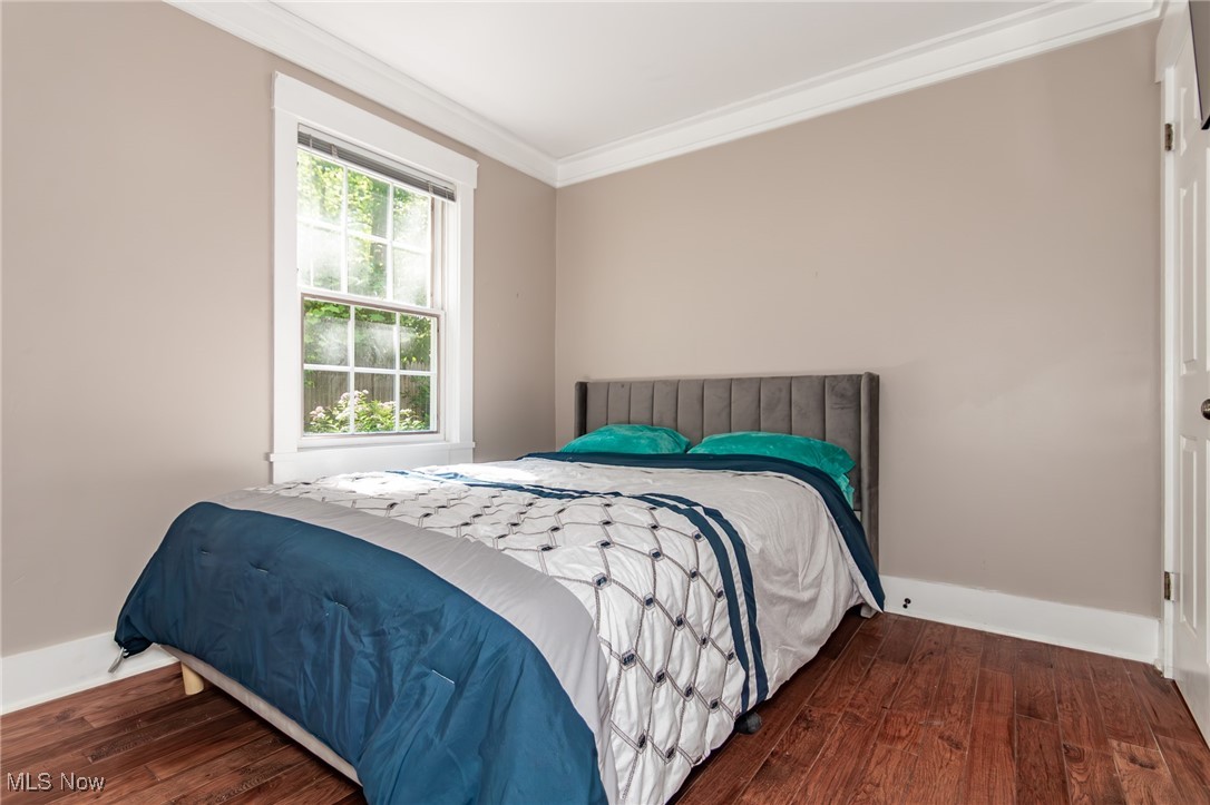 7806 Fairidge Road Willoughby, OH 44094 - Photo 23 of 41 Bedroom featuring hardwood / wood-style flooring and ornamental molding