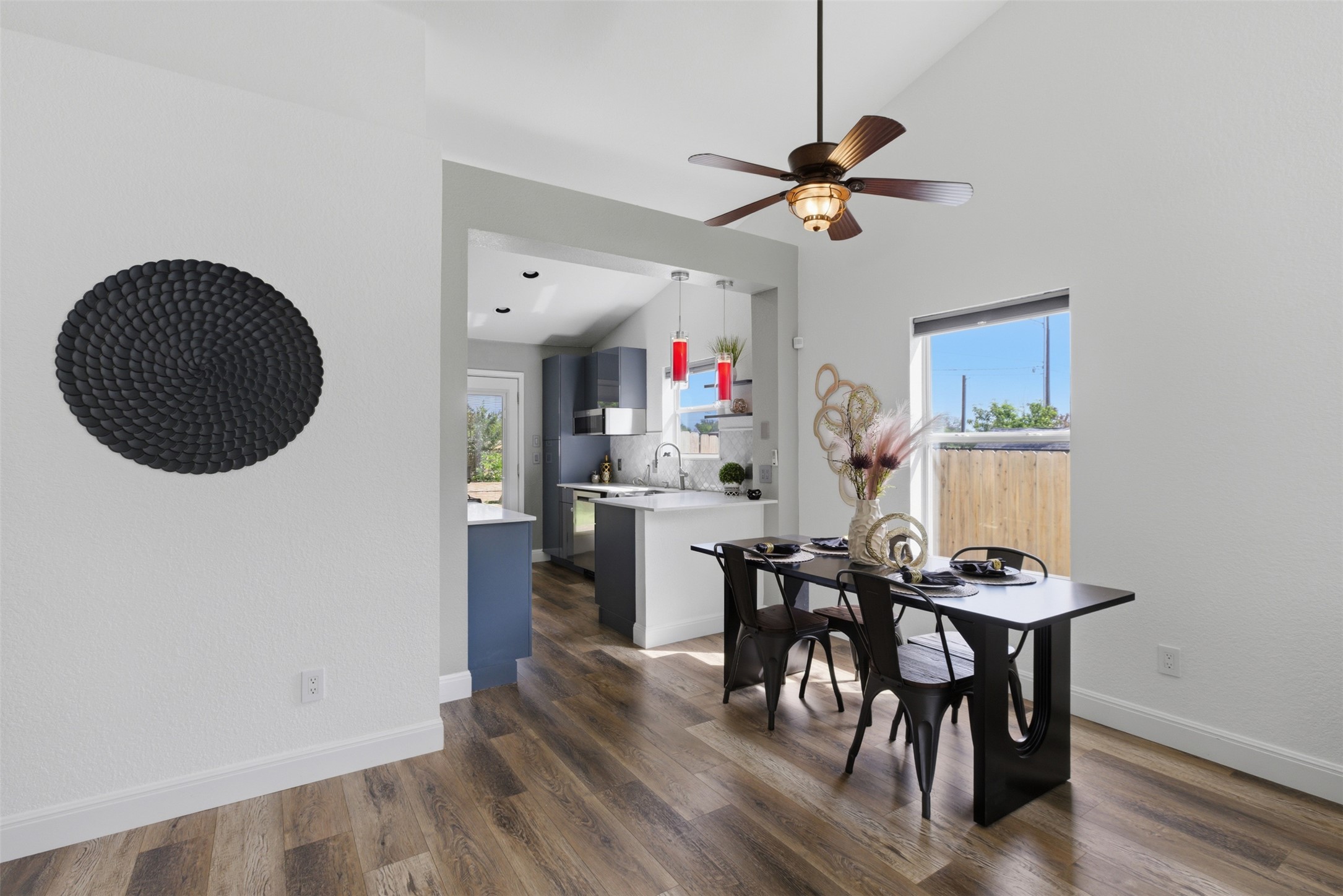 112 Prairie Springs Loop Georgetown, TX 78626 - Photo 4 of 23 a view of a dining room with furniture and a chandelier fan