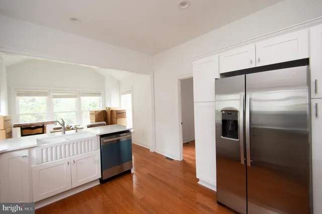 a view of kitchen with furniture and wooden floor