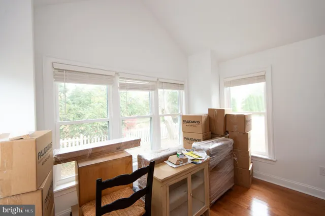 a view of livingroom with hardwood floor and a ceiling fan