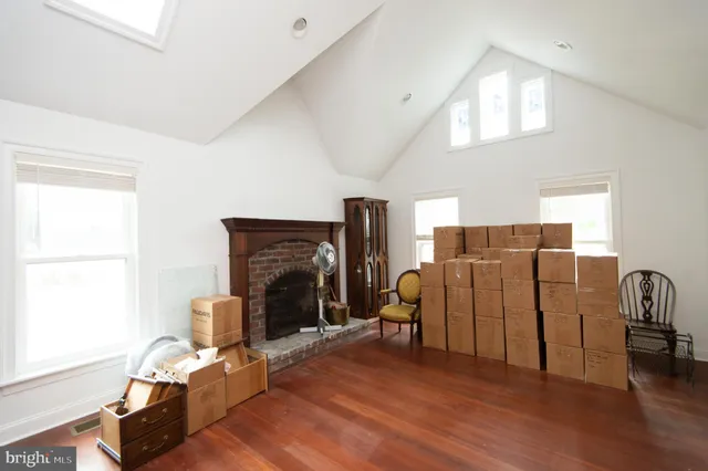 a bathroom with a tub sink vanity and a mirror