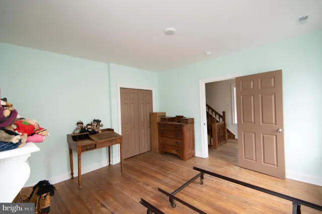 a view of an outdoor space with wooden floor and a ceiling fan