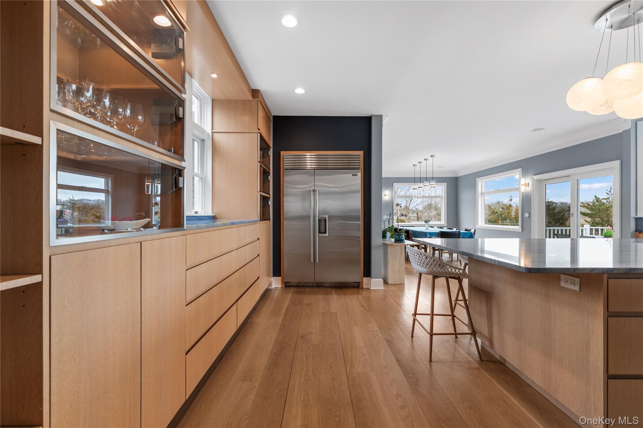 14 South Country Road Westhampton, NY 11977 - Photo 11 of 45 a kitchen with counter top space and wooden floor