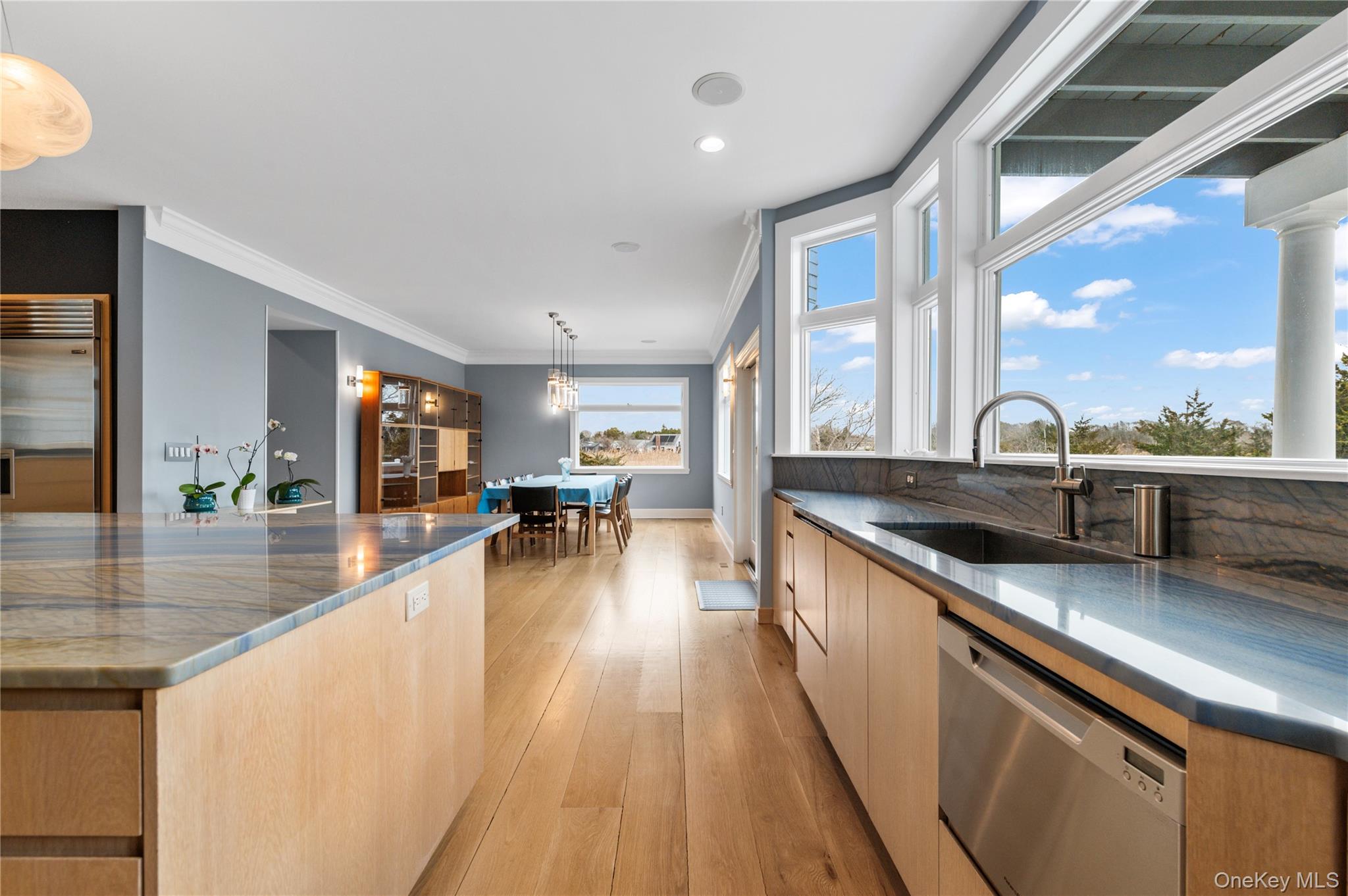 14 South Country Road Westhampton, NY 11977 - Photo 13 of 45 a large kitchen with stainless steel appliances a lot of counter space and a large window