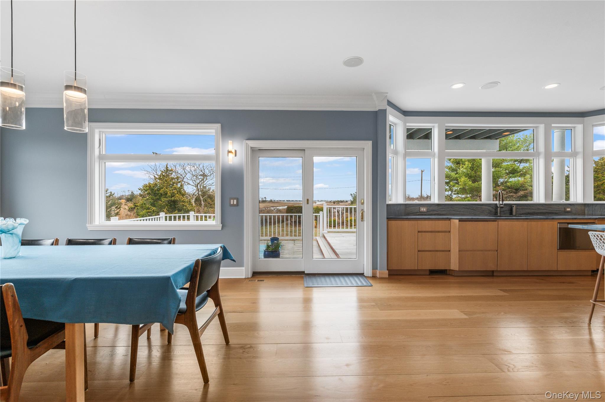 14 South Country Road Westhampton, NY 11977 - Photo 16 of 45 a view of a dining room with furniture window and wooden floor