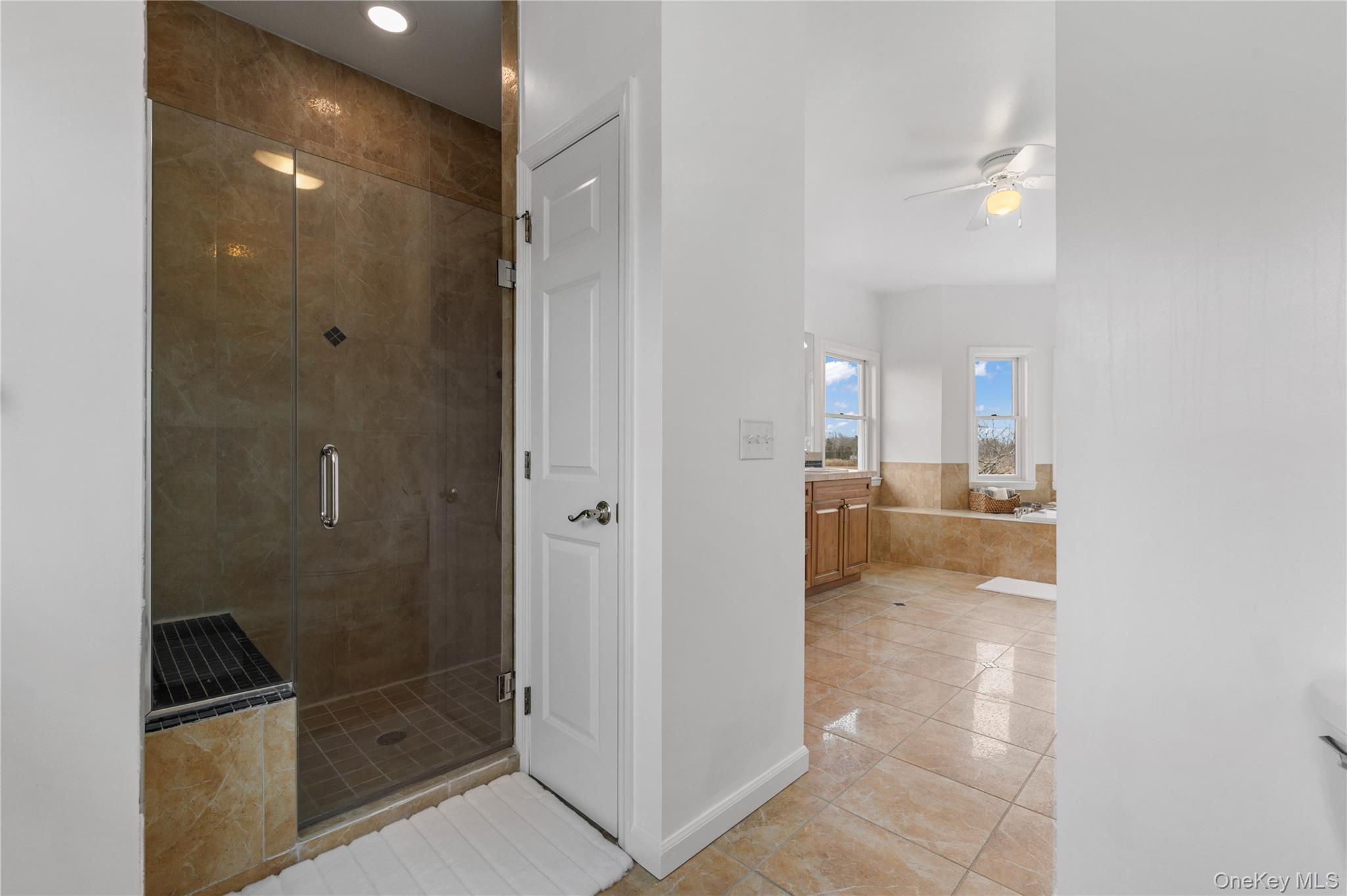 14 South Country Road Westhampton, NY 11977 - Photo 34 of 45 a bathroom with a glass shower door