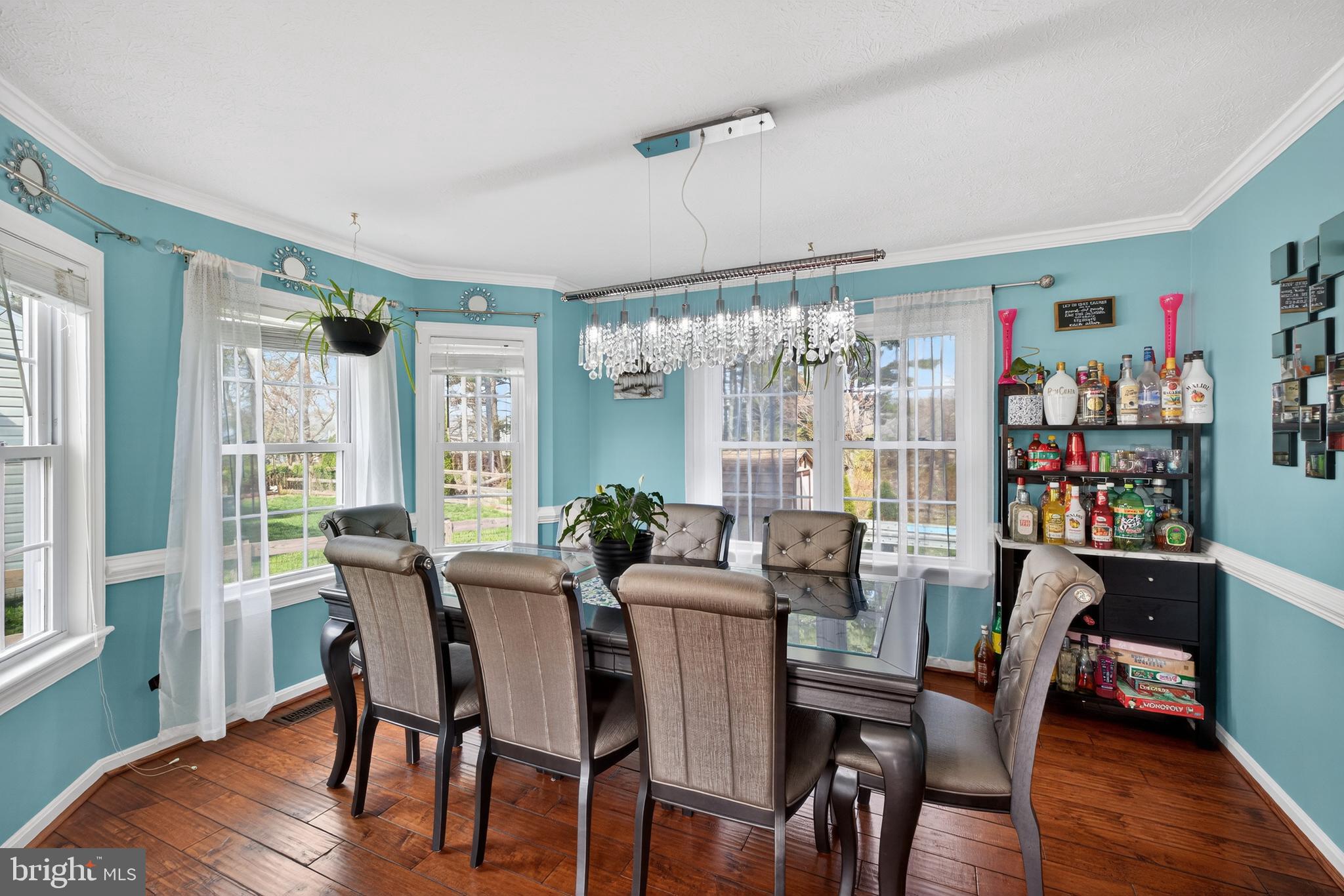 611 Hunting Ridge Drive Frederick, MD 21703 - Photo 11 of 50 a view of a dining room with furniture window and wooden floor