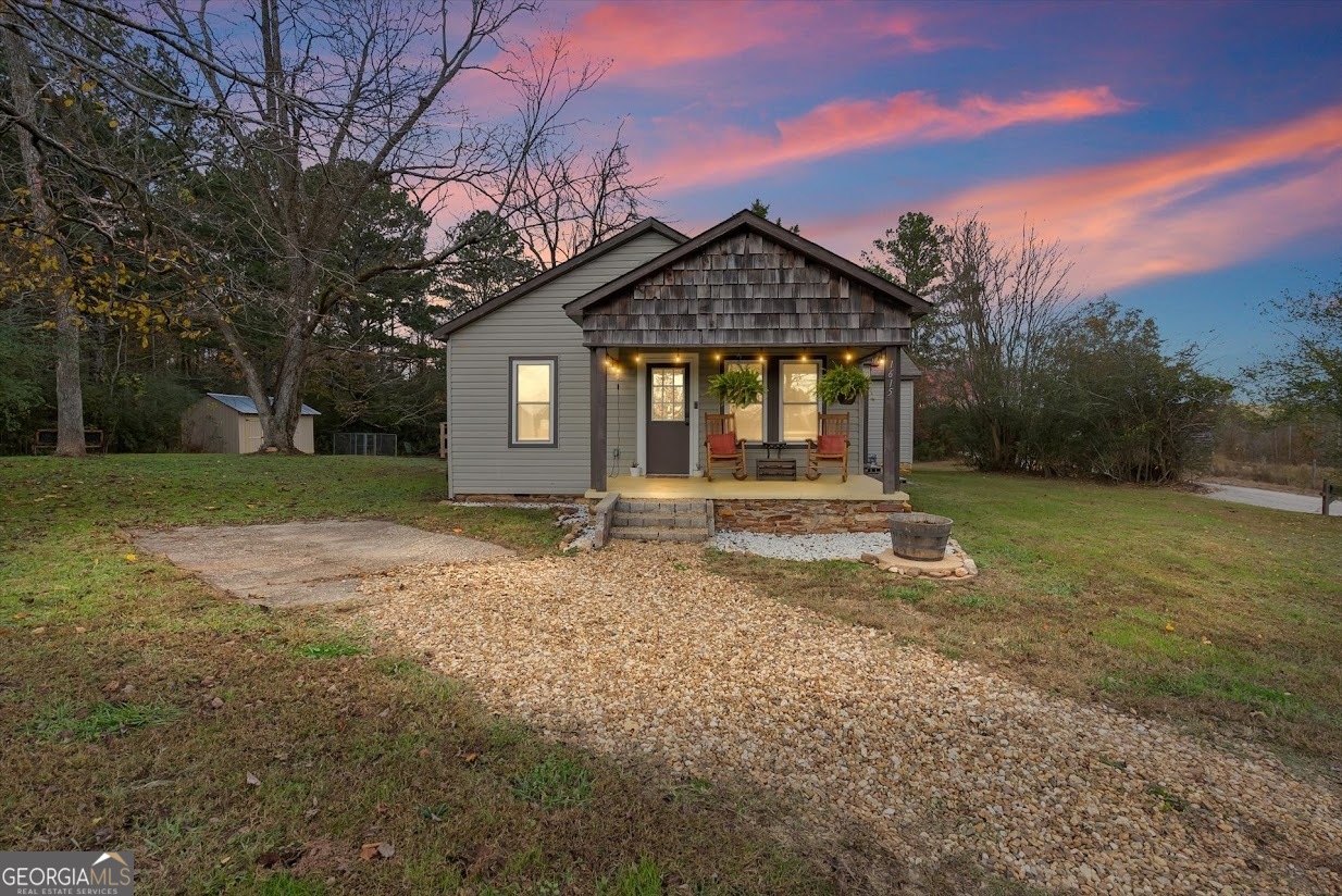 1615 Teague Road Bowdon, GA 30108 - Photo 1 of 1 a front view of a house with a yard