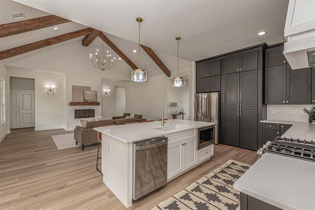 360 Dalton Road Canton, TX 75103 - Photo 8 of 33 Open-concept kitchen and living area featuring vaulted ceilings with exposed wood beams