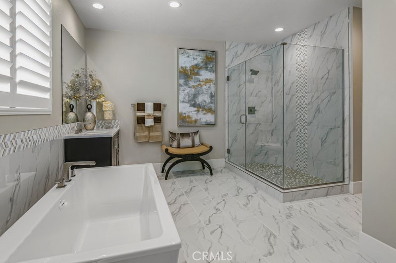 6517 Canyon Oaks Drive Simi Valley, CA 93063 - Photo 26 of 35 a bathroom with a bathtub and a shower