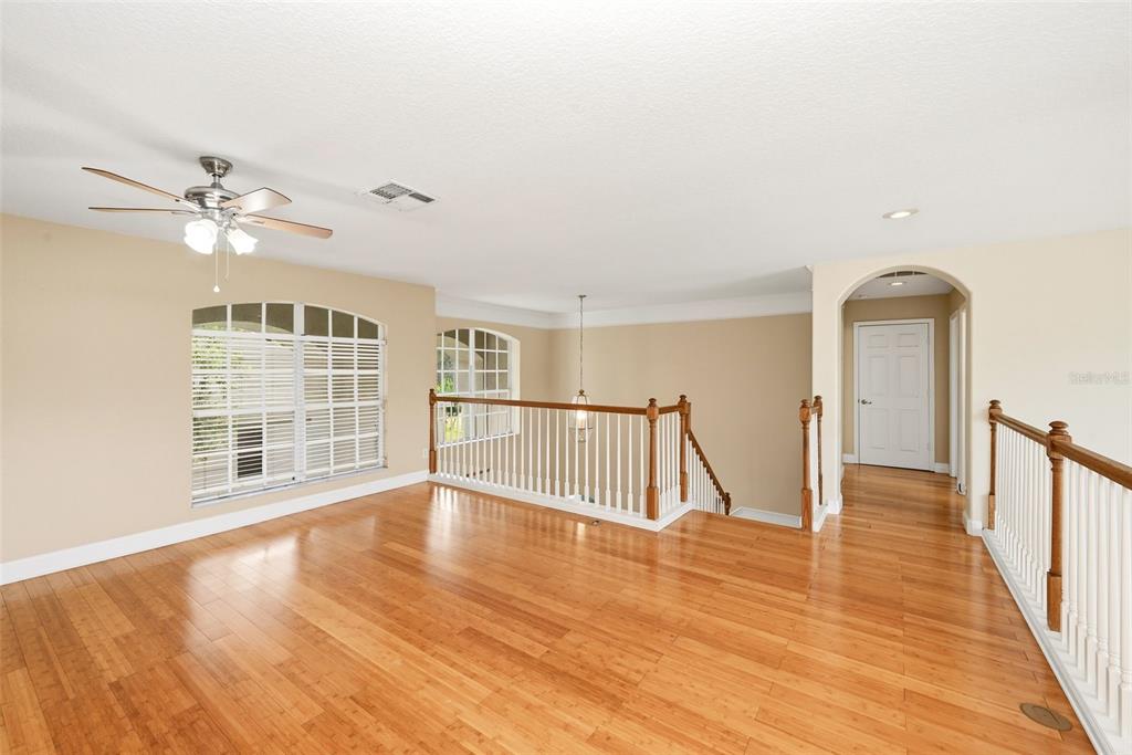 936 Kingsridge Circle Gotha, FL 34734 - Photo 22 of 50 a view of an empty room with wooden floor and a window
