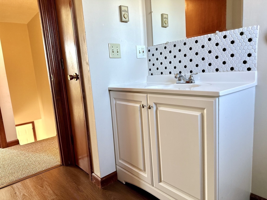 153-155 Arnold Avenue Springfield, MA 01119 - Photo 12 of 17 a close view of a sink a mirror and door