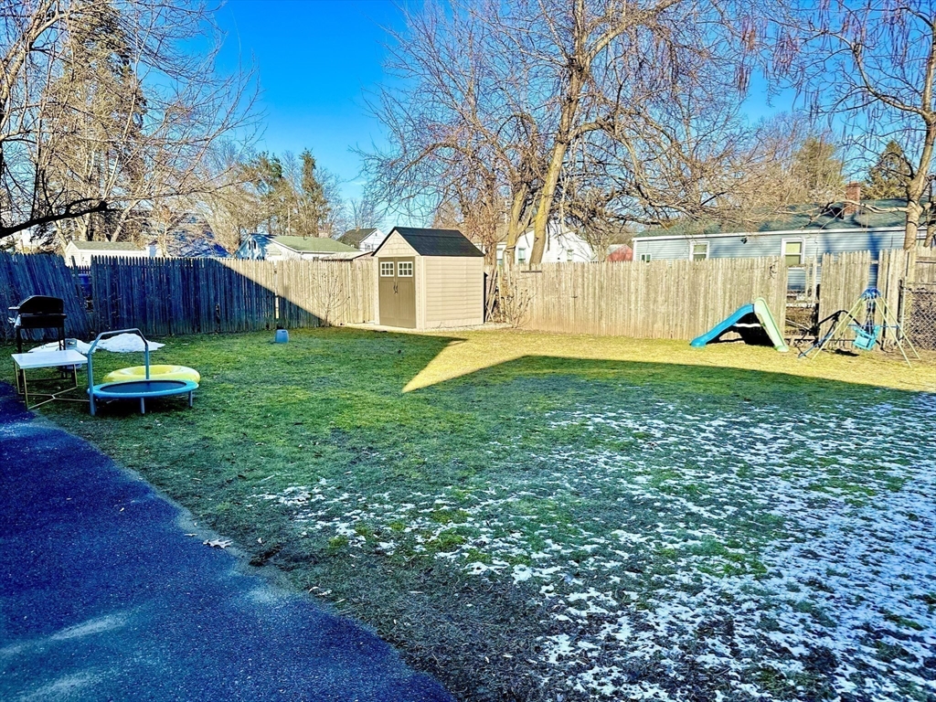 153-155 Arnold Avenue Springfield, MA 01119 - Photo 16 of 17 a view of a house with backyard and sitting area