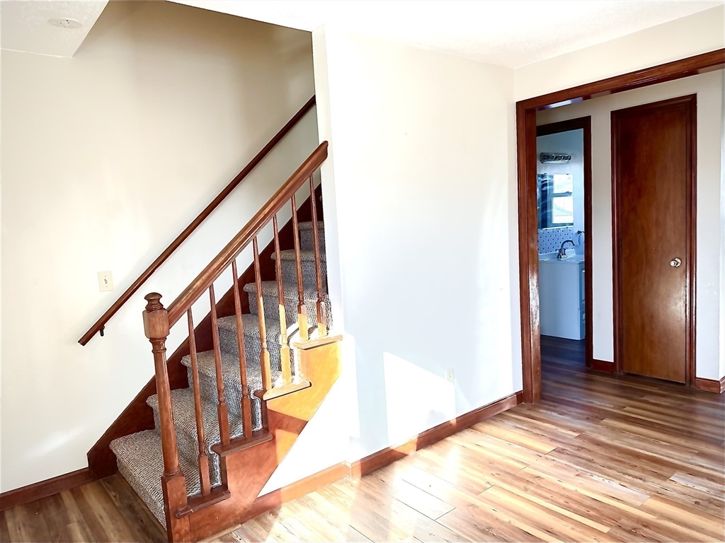 153-155 Arnold Avenue Springfield, MA 01119 - Photo 5 of 17 a view of entryway and hall with wooden floor