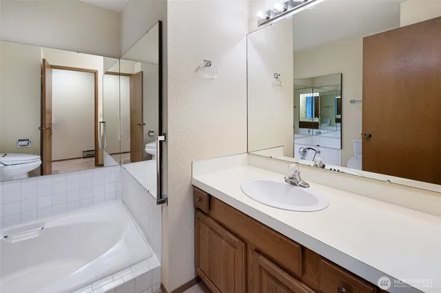 a bathroom with a sink and a large mirror
