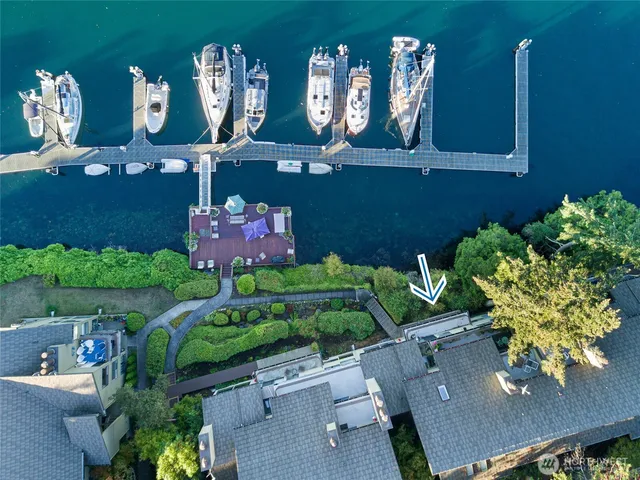 an aerial view of a house with yard swimming pool and outdoor seating