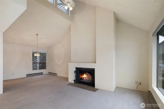 a view of an empty room with a fireplace