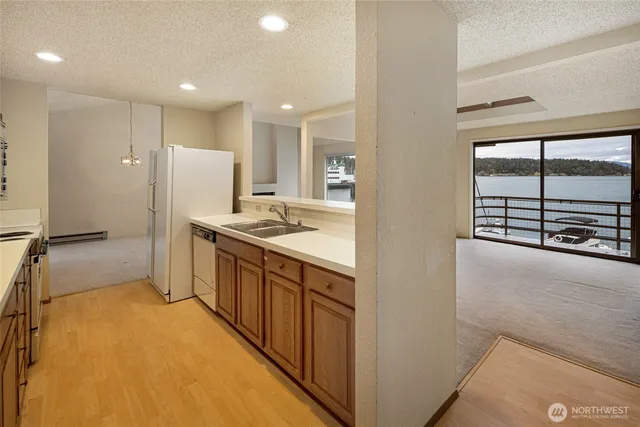a kitchen with stainless steel appliances a refrigerator and a stove