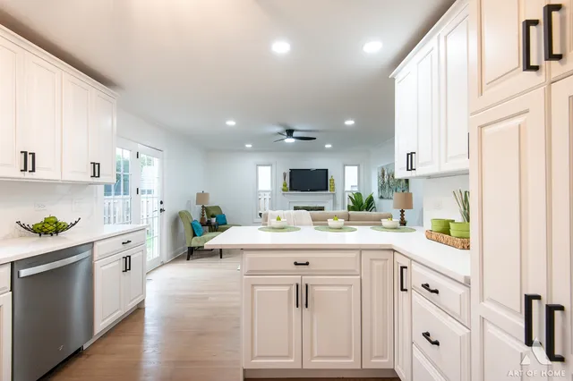 a kitchen with a sink a stove and cabinets