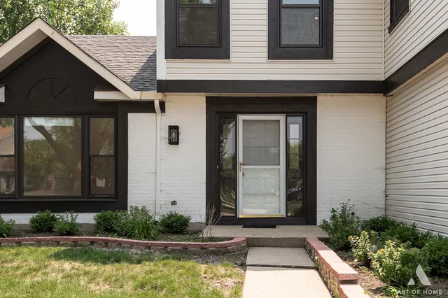 a house with swimming pool in front of it