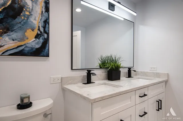 a bathroom with a sink a vanity and mirror