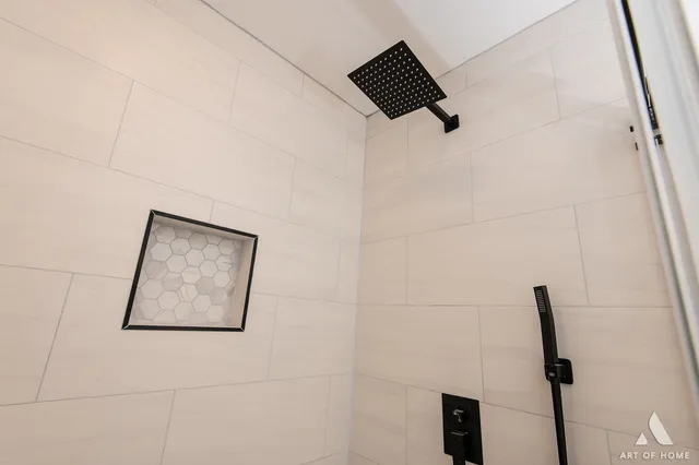 a picture of a bathroom with a shower and a window