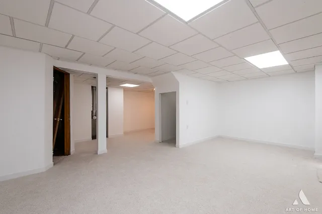 a view of an empty room and a window