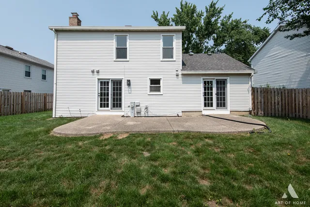 a view of a house with backyard and yard