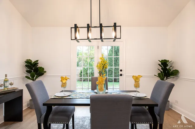 a view of a dining room with furniture and window