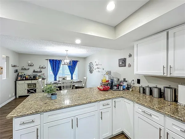 a kitchen with sink and cabinets