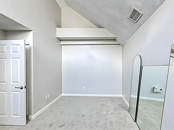 a view of front door with entryway and livingroom