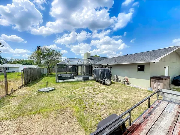 a swimming pool with lawn chairs