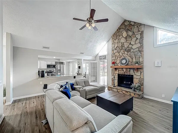 a living room with furniture and a fireplace