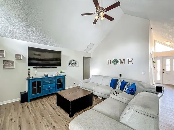a living room with furniture and a flat screen tv