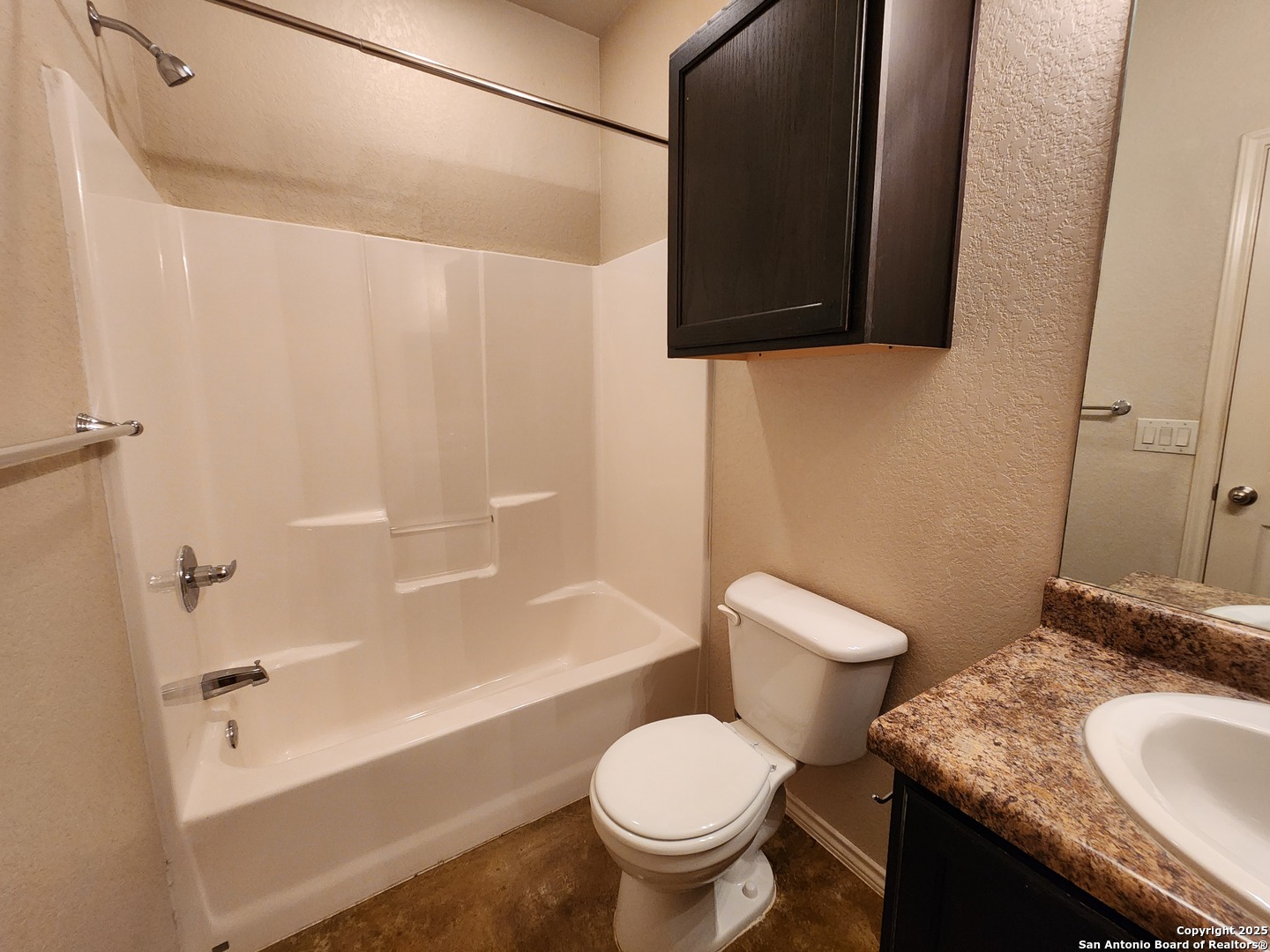 210 Anne Louise Drive New Braunfels, TX 78130 - Photo 15 of 18 a bathroom with a granite countertop toilet sink and mirror