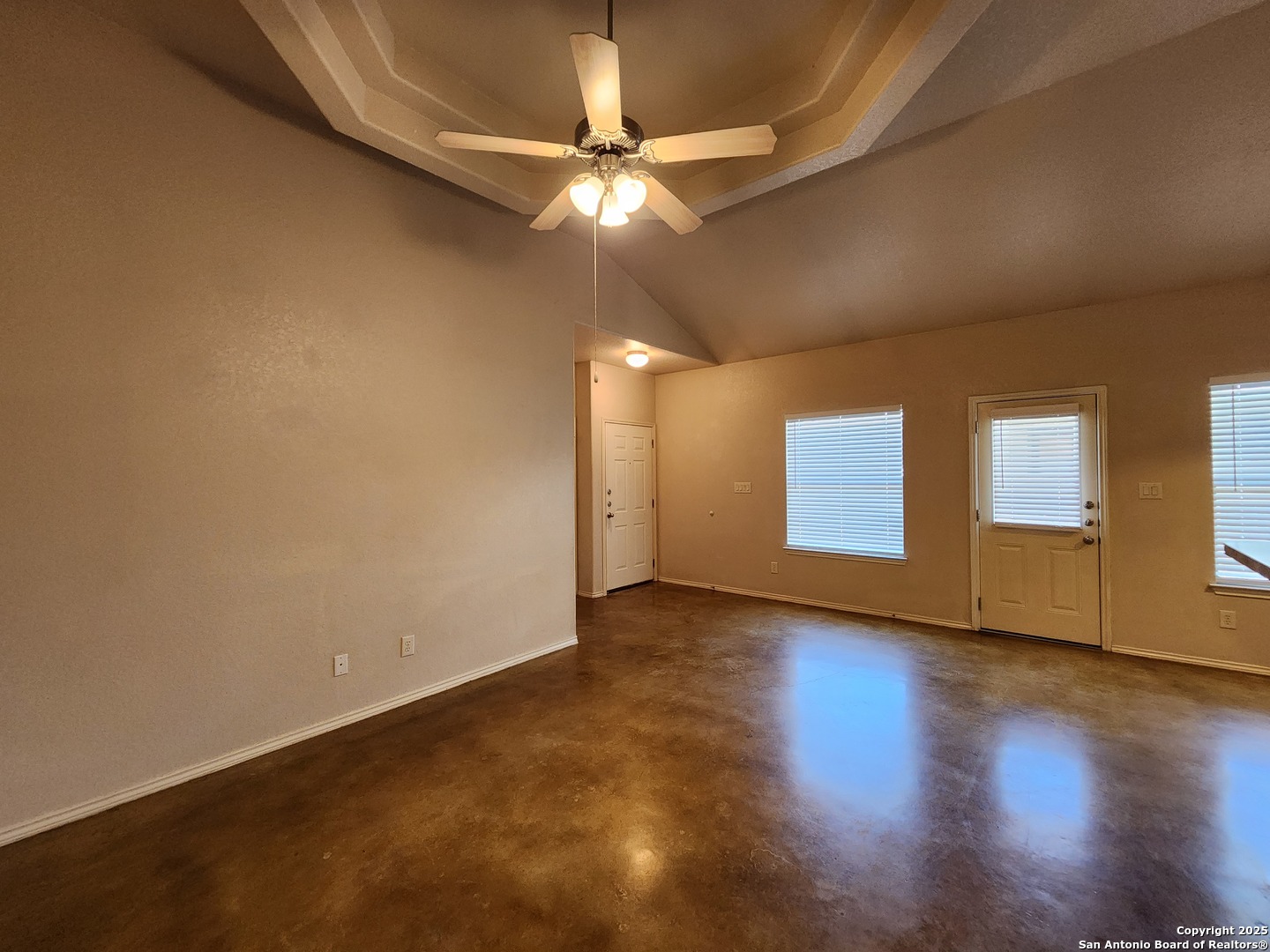 210 Anne Louise Drive New Braunfels, TX 78130 - Photo 3 of 18 an empty room with wooden floor and fan