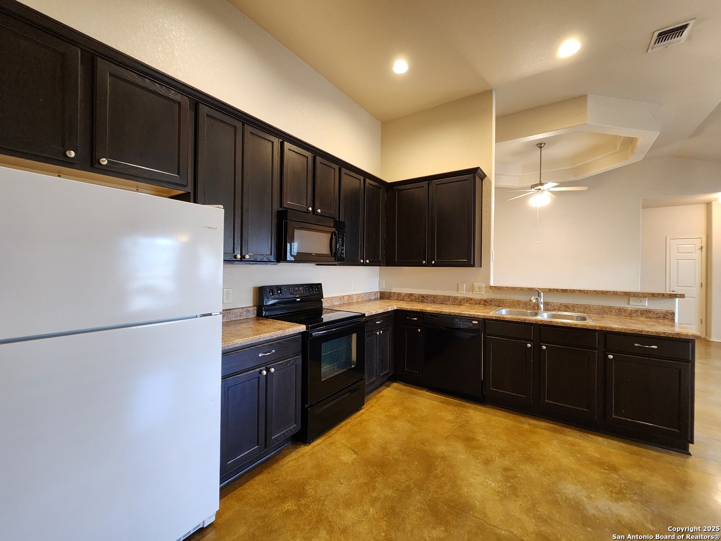210 Anne Louise Drive New Braunfels, TX 78130 - Photo 4 of 18 a kitchen with stainless steel appliances granite countertop a refrigerator a sink dishwasher a stove top oven and a sink