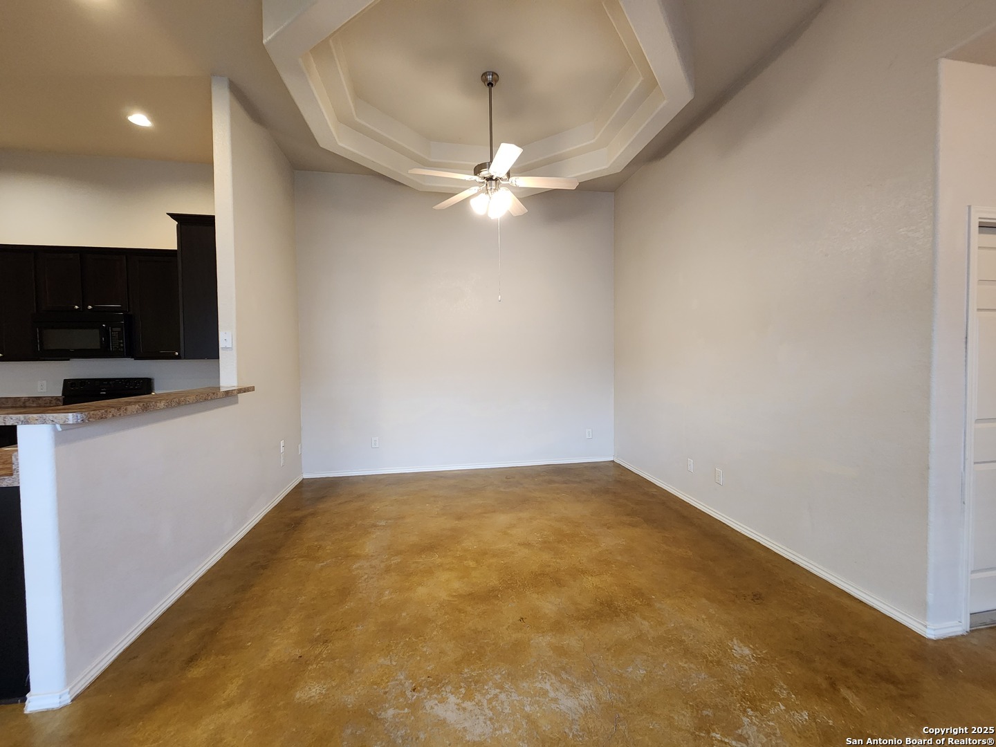 210 Anne Louise Drive New Braunfels, TX 78130 - Photo 6 of 18 a view of an empty room with a ceiling fan