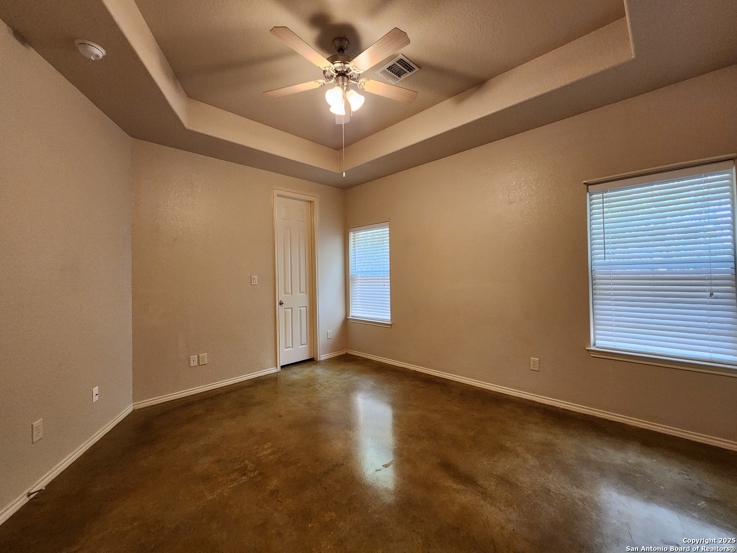 210 Anne Louise Drive New Braunfels, TX 78130 - Photo 7 of 18 an empty room with windows and fan